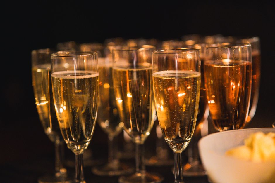 Champagne glasses toast at a buffet catering event